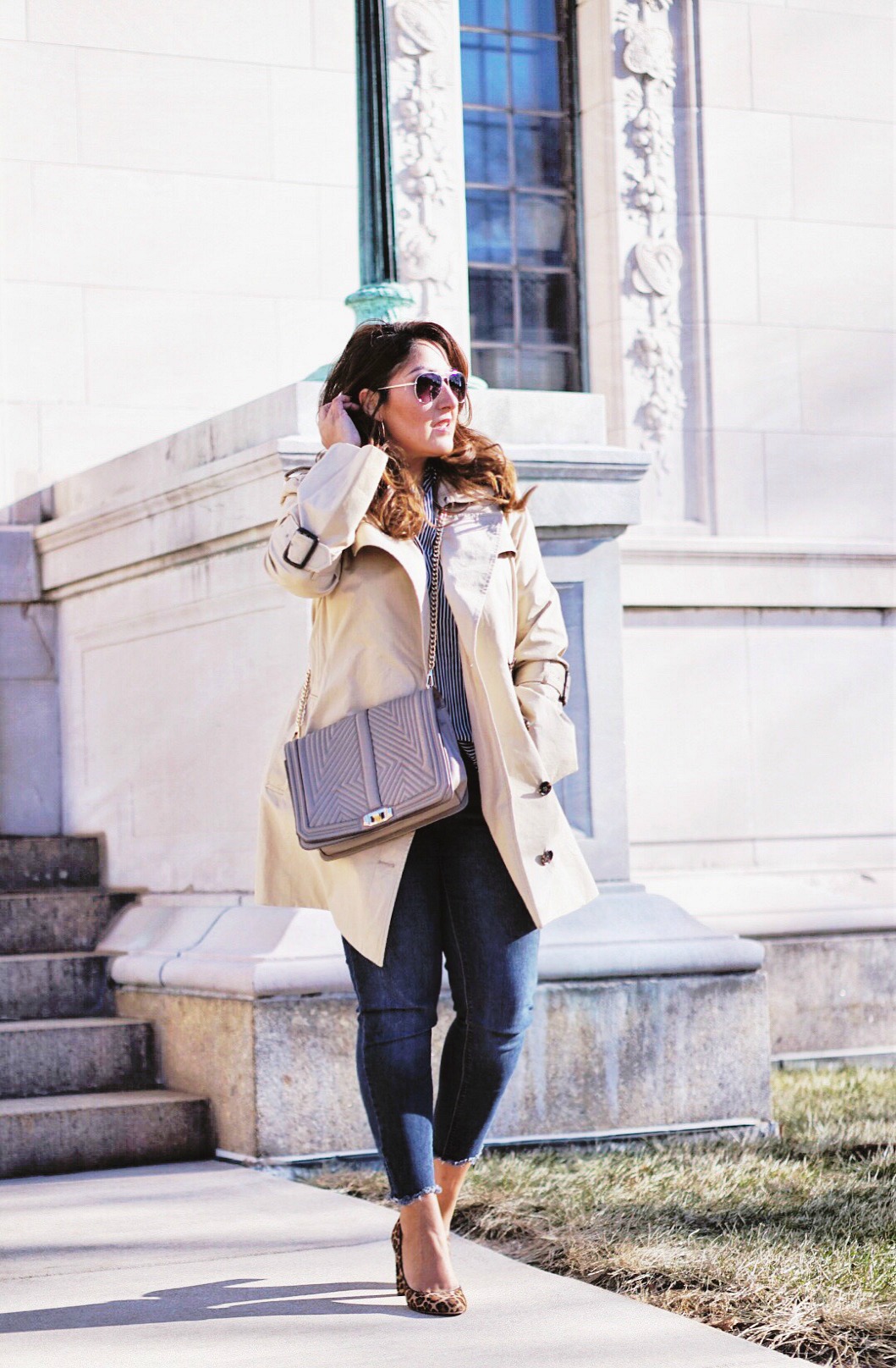 Styling the trench coat for a casual look.
